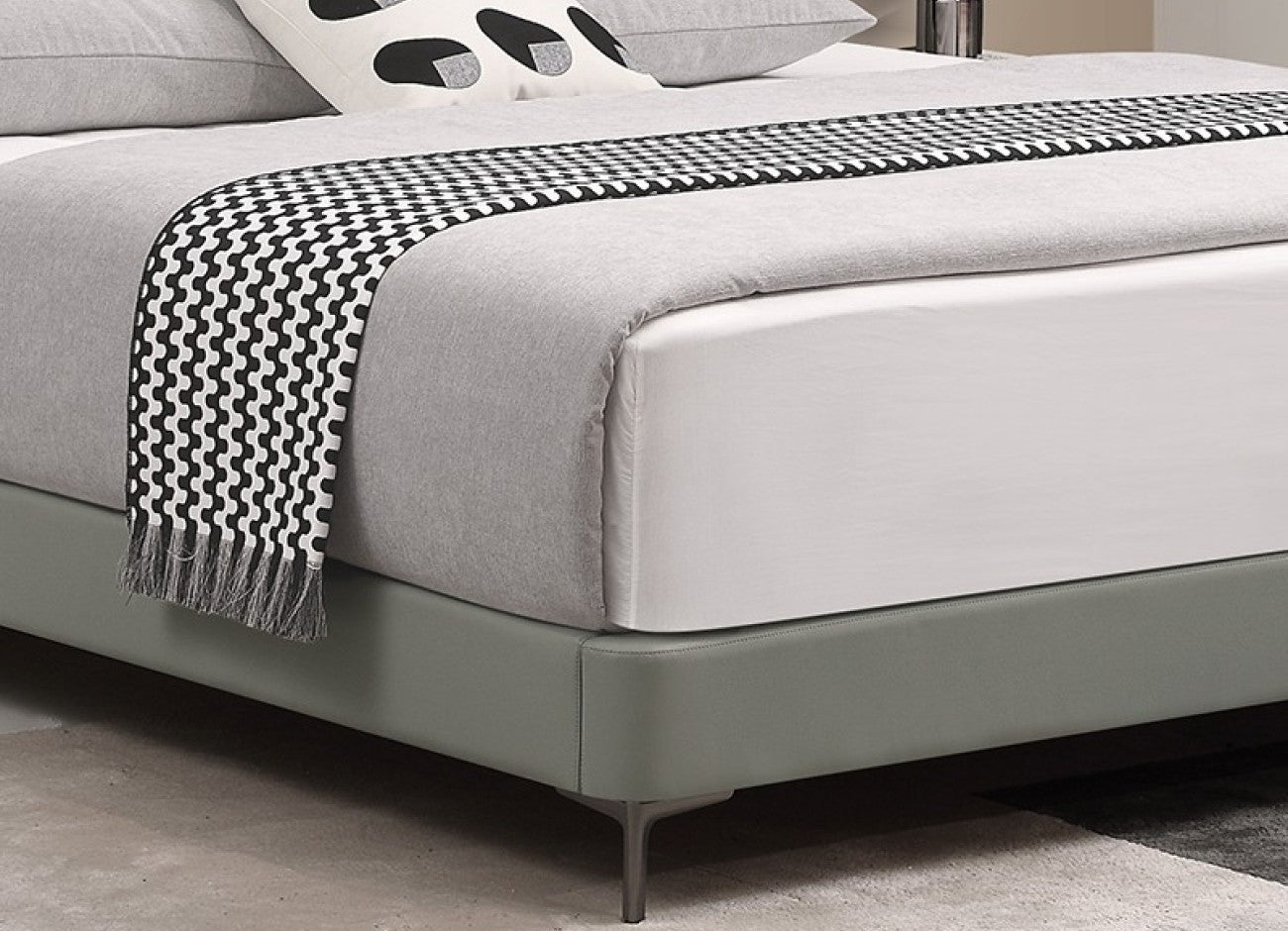 Minimalist Upholstered Bed with Cowhide Headboard and Elevated Metal Legs