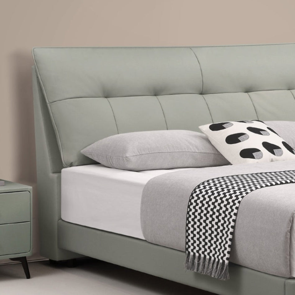 Minimalist Upholstered Bed with Cowhide Headboard and Elevated Metal Legs