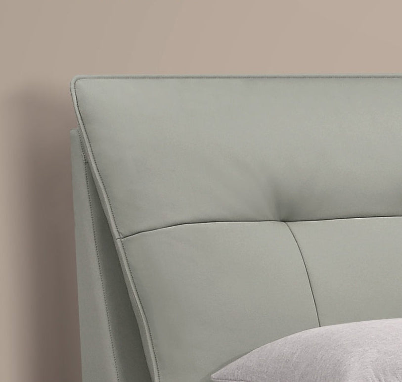 Minimalist Upholstered Bed with Cowhide Headboard and Elevated Metal Legs